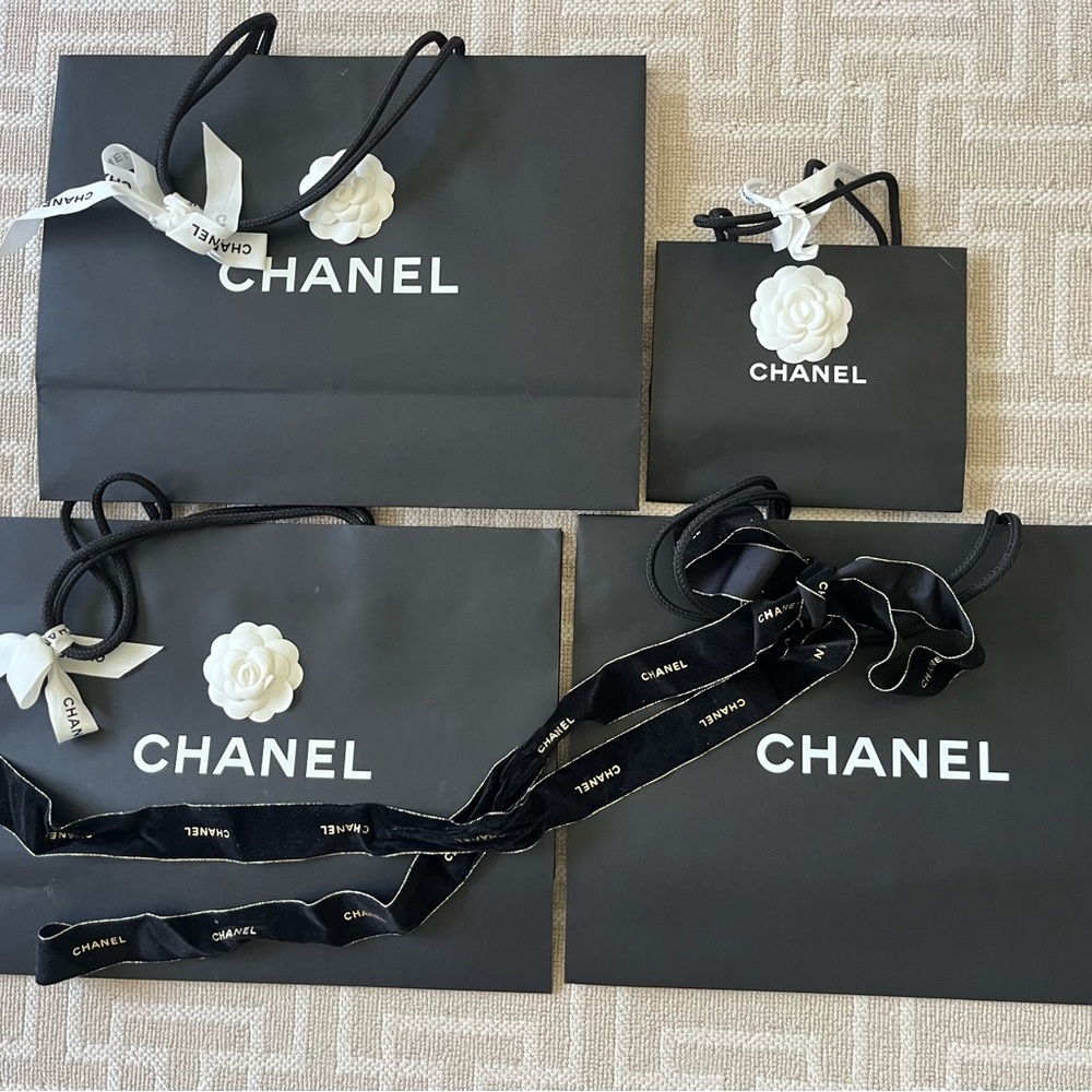 CHANEL Black Shopping Bags with Iconic White Logo, Camellias and ribbons.